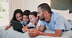 Tablet, smile and family on bed in home, learning or watch funny cartoon for bonding together. Technology, happy kids and parents in bedroom on internet for streaming app, laughing and game to relax