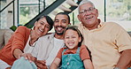 Grandparents, father and daughter on sofa with face, smile or relax together with hug for bonding in house. People, dad and girl with embrace, connection and happy for reunion on couch in family home