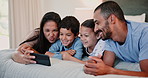 Family, relax on bed and selfie for memory with smile and funny face, social media post and bonding. Mother, father and kids in bedroom, happy people in picture with photography and playful at home