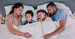 Happy family, sleeping and relax with cuddle on bed for comfort, rest or weekend together above at home. Top view of mother, father and children asleep under duvet sheets or comforter in bedroom