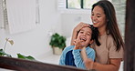 Mother, brushing teeth and hair of happy son in bathroom mirror of home, getting ready with a smile. Happy, boy child and funny in apartment with single parent talking or laughing for morning routine