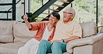 Home, selfie and old couple on a couch, love and memory with social media post and romance. Apartment, happy elderly man and senior woman on sofa, marriage or relationship with digital app for camera