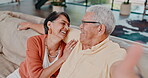 Face, senior couple and sofa to laugh, talk and playful for bonding together in retirement in home. Old man, woman and smile for quality time, relax and funny joke on couch in living room in Brazil