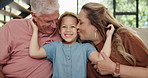 Grandpa, grandma and kiss with grandchild on sofa for love, support or care together at home. Grandparents and young granddaughter with smile for embrace, holiday weekend or summer break at the house