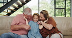 Elderly man, woman and face of kid with smile for adoption, childhood development and care in living room. Family, grandfather and child with happiness for love, bonding and relax together on sofa