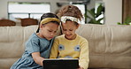 Children, tablet and siblings on sofa for cartoon, search or remote e learning app, sign up or streaming at home. Digital, family and girl kids in living room for online, gaming or Netflix and chill