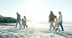 Happy family, holding hands and generations walking on beach, sunset and love with bonding on summer holiday. Dad, mom and kids on sea sand with grandparents, blue sky and relax in nature on vacation