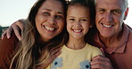 Happy, face and girl with grandparents at a beach for travel, bonding or having fun on vacation together. Love, portrait and senior people hug child in nature for holiday, reunion or weekend visit