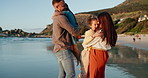 Parents carrying kids, beach and sunshine with fun, happiness and playing with weekend break. Bonding together, family and mother with father and children with holiday, smile or seaside with vacation