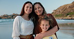 Beach, face and mother with granny, kid and happiness with hug or bonding together with vacation. Portrait, family, mama and grandma with girl and embrace with sunshine, smile or holiday with seaside