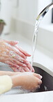 Hands, sink and cleaning bacteria for hygiene, gems and healthcare and protection from viruses. Adult, person and parent helping, show and teaching child to wash dusk or  dirt with water from faucet