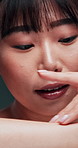 Hand, arm and face of asian woman with skincare in studio for glowing skin, texture or results closeup. Body, beauty or portrait of Japanese female model with dermatology, cosmetics or treatment glow