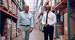 Warehouse, collaboration and men walking in manufacturing, export and storage company. Management, stock and business people with inspection of freight and supply chain with conversation and planning