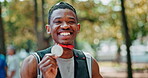 Black man, sportsman and happy face with medal for winning or success, marathon and long distance running. Athlete, achievement and victory for track outdoors, pride and fitness for sprinting race