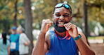 Black man or face, celebrate and athlete with medal for winning or success, marathon and long distance running. Sportsman, achievement and victory for track outdoors, pride and fitness for sprinting.