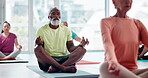 Man, lotus and meditating in yoga class for peace, calm and mental health with wellness or mindfulness. People or group eyes closed for spiritual, holistic and breathing exercise to relax or chakra