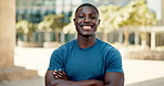 Fitness, face and black man with confidence in city for exercise, workout or training outdoor for body health in Kenya. Portrait, smile and sports athlete with arms crossed or African person in town