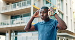 Headphones, fitness and black man in city for running, training or marathon, cardio or morning routine. Exercise, start or African male runner with music, energy and workout, challenge or performance