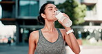 Woman, runner and drinking water for outdoor workout or training fitness for healthy wellness, hydration or athlete. Female person, bottle and nature cardio in summer for morning, challenge or rest