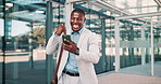 Businessman, excited or winning on a phone in city commute or outdoor travel with good news. Success, employee or happy black man with victory in urban area or Cape Town with message or notification