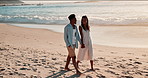 Walking, beach and black couple with love, holiday and anniversary with celebration and marriage. Waves, seaside and man with woman and honeymoon with relationship, water and vacation with adventure