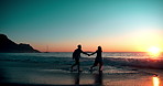 Couple, ocean and waves with running at sunset for vacation, holiday and date together in Los Angeles. Man, woman and holding hands at beach for fun, romance and adventure in summer with freedom