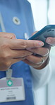 Medical doctor, hands or typing on cellphone in hospital, research or drug reference guide for prescription. Specialist, text or digital patient records on mobile app or remote consultation in clinic