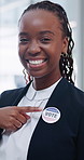 Politics, badge and face of black woman pointing for election, vote or choice. Vertical, happiness and portrait female person with button for registration, democratic party and support for change