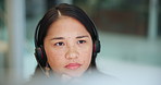 Asian woman, call center and consultant thinking with headphones for customer service or support at office. Face of young female person or agent in wonder for online advice or help at workplace