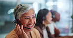 Senior woman, agent and call center with headphones in customer service or support at office. Happy female person, consultant or agent consulting for online advice, assistance or help at workplace