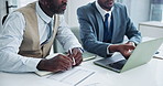 Business people, laptop and paper at desk for teamwork, collaboration and planning for financial investment. Black man, documents and technology with discussion for report, review or research advice