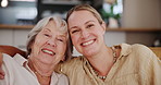 Family, happy or hug with senior mother and daughter on sofa in living room of home for bonding visit. Portrait, love or smile with parent and woman in retirement apartment together on mothers day