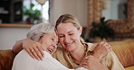 Smile, love or hug with senior mother and daughter on sofa in living room of home for bonding visit. Mothers day, family or happy with parent and woman in retirement apartment together to relax