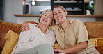 Smile, love or hug with senior mother and daughter on sofa in living room of home for bonding visit. Portrait, mothers day love and happy parent with woman in retirement apartment together to relax