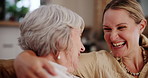 Family, funny or hug with senior mother and daughter on sofa in living room of home for bonding visit. Mothers day, smile or laughing with parent and woman in retirement apartment together to relax