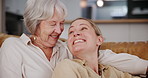 Family, love or hug with senior mother and daughter on sofa in living room of home for bonding visit. Mothers day, smile or happy with parent and woman in retirement apartment together to relax