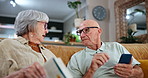 Elderly, couple and cellphone for technology discussion with book for learning information, questions or connection. Man, woman and conversation with smartphone or instructions, digital or internet