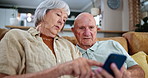 Elderly, couple and cellphone on couch for technology learning in retirement for online network, questions or message. Man, woman and smartphone on sofa for teaching communication, explain or helping