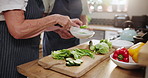 People, hands and cutting vegetables with bowl for food preparation, diet or healthy meal in the kitchen. Closeup of person, chef or cook with natural slices of organic green salad for snack at home