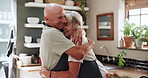 Senior, couple and hug in kitchen with love, support and care in marriage and retirement. Elderly, man and woman embrace with kindness or gratitude for cooking dinner in home together with happiness