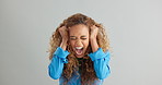 Woman, anger and shouting with depression in studio for stress, mental health or death by background. Girl, person or model with anxiety, frustrated and screaming with pulling hair in panic attack