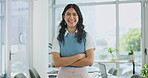 Woman, face and laughing with arms crossed in office for confidence in creative career and pride for startup. Professional, portrait and employee with happiness, humor and break at modern company 