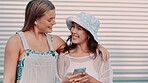 Friends, phone and laugh in conversation outdoors, smile and internet for comic meme on social media. Happy women, embrace and online for funny blog or web, talking and bonding by wall background