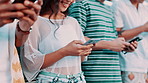 Group, hands and texting with phone in city by garage for contact, blog or connection with diversity. Men, women or gen z people on smartphone, typing or reading for chat, streaming or social network
