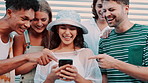 Woman, friends and phone in city for meme, reading and share app for funny video on urban sidewalk. Men, women and gen z people with smartphone for chat, comic post or blog with social media in road