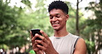 Happy, phone and fitness man in a park with social media, chat or location search in nature. Smartphone, app and male runner in a forest online for path navigation, internet or exercise blog update