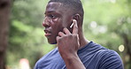 Fitness, music and runner black man getting ready for start of workout in garden or park for wellness. Exercise, running and sports with confident young athlete outdoor for training or workout