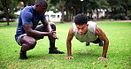 Push ups, fitness or workout with man and personal trainer outdoor in field together for performance. Exercise, sports or clapping for motivation with athlete and coach training at park in summer