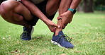 Man, athlete and ankle pain on sport field for body workout with hands and anatomy outside. Exercise, wellness and black person with leg or injury in emergency with inflammation and painful muscle 