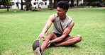 Runner, park and stretching with workout, pain and cardio for exercise and health. African man, training and risk with injury, muscle and sneakers for marathon performance with fatigue and wellness